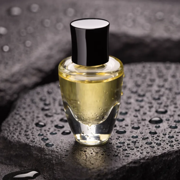 Recraft V4.1’s picture for “A glass perfume bottle on wet black stone, soft studio lighting, water droplets, high-end product photography”